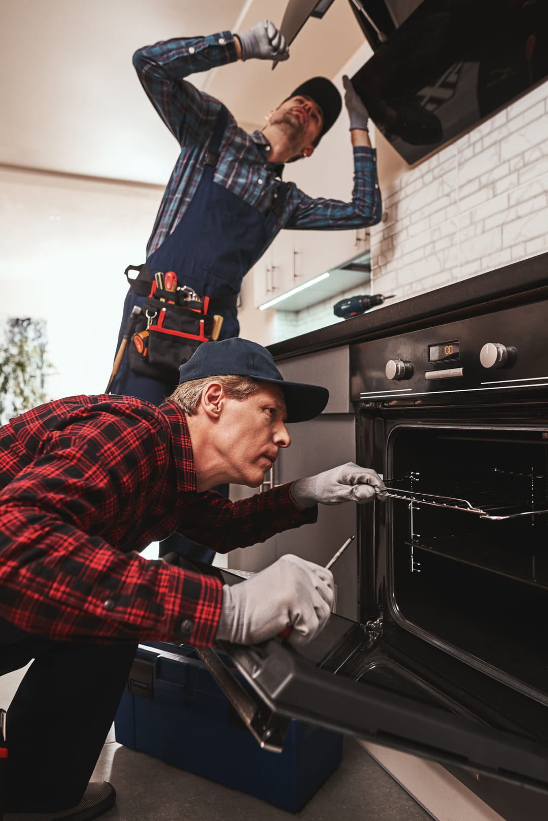 productive-together-photo-two-mechanics-working-kitchen