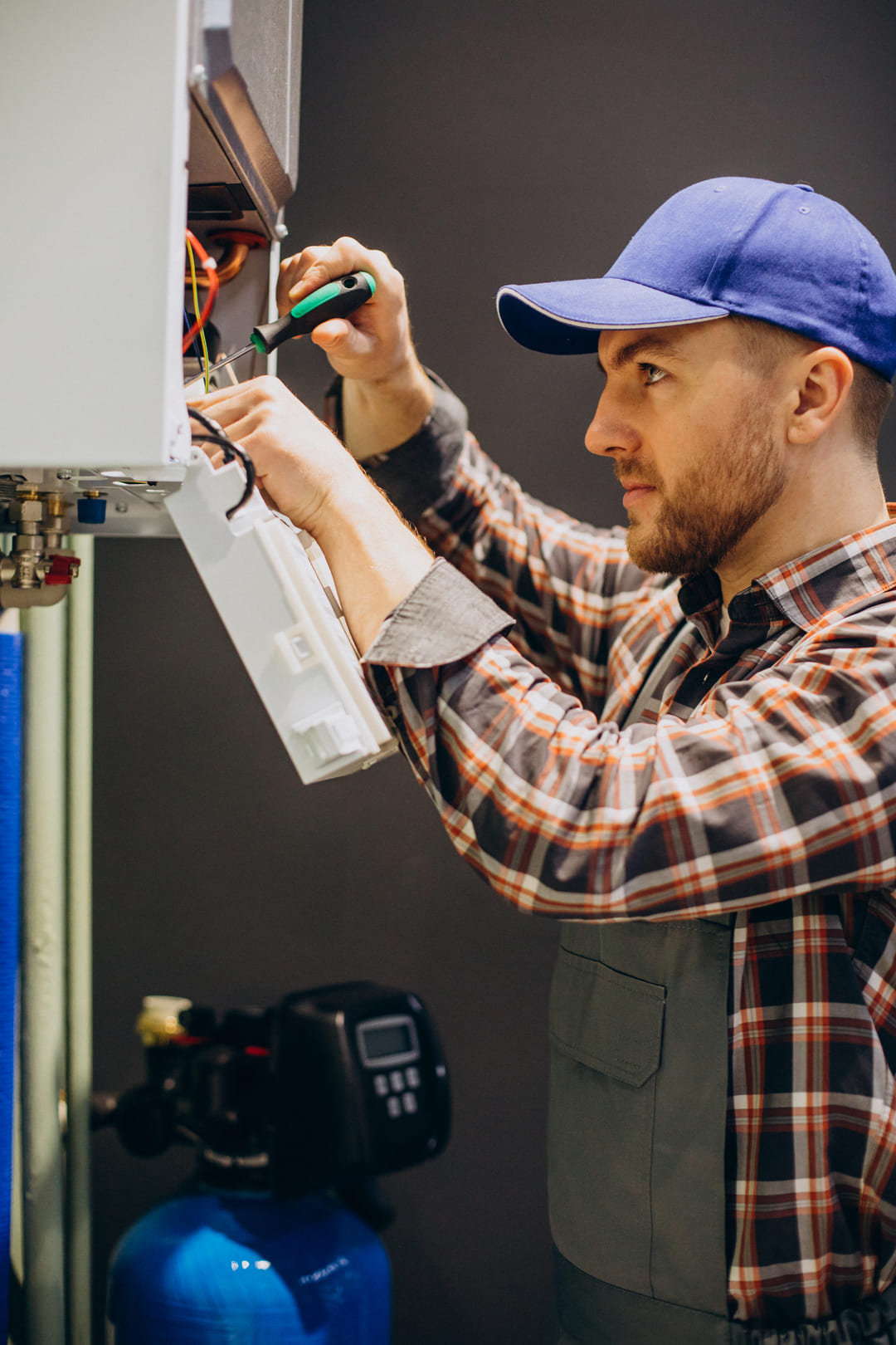 service-man-adjusting-house-heating-system (1)